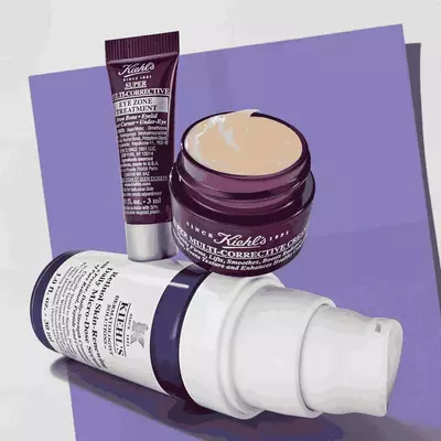 Kiehl's skincare set featuring full-size retinol serum and multi-corrective cream, alongside an eye treatment. Promotional elements indicate price and value.